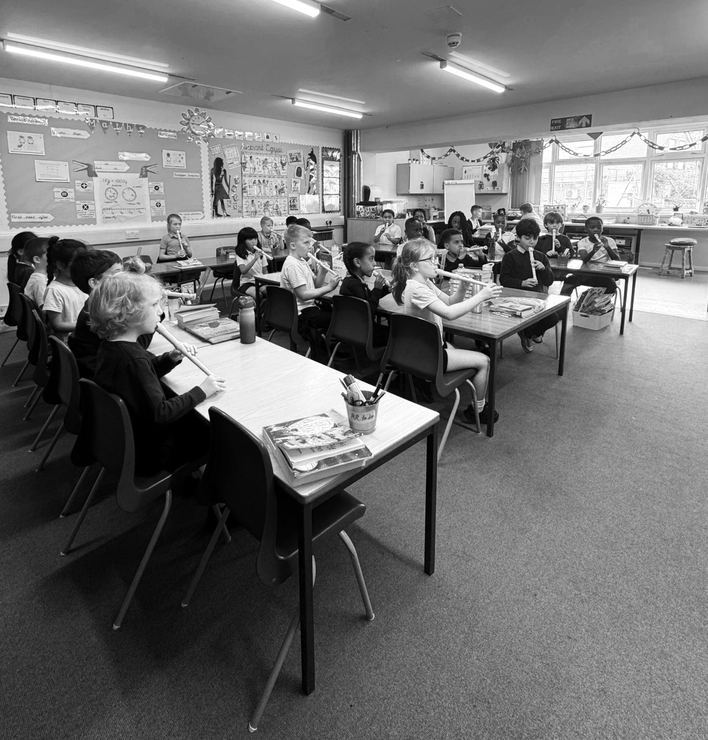 School children playing recorder