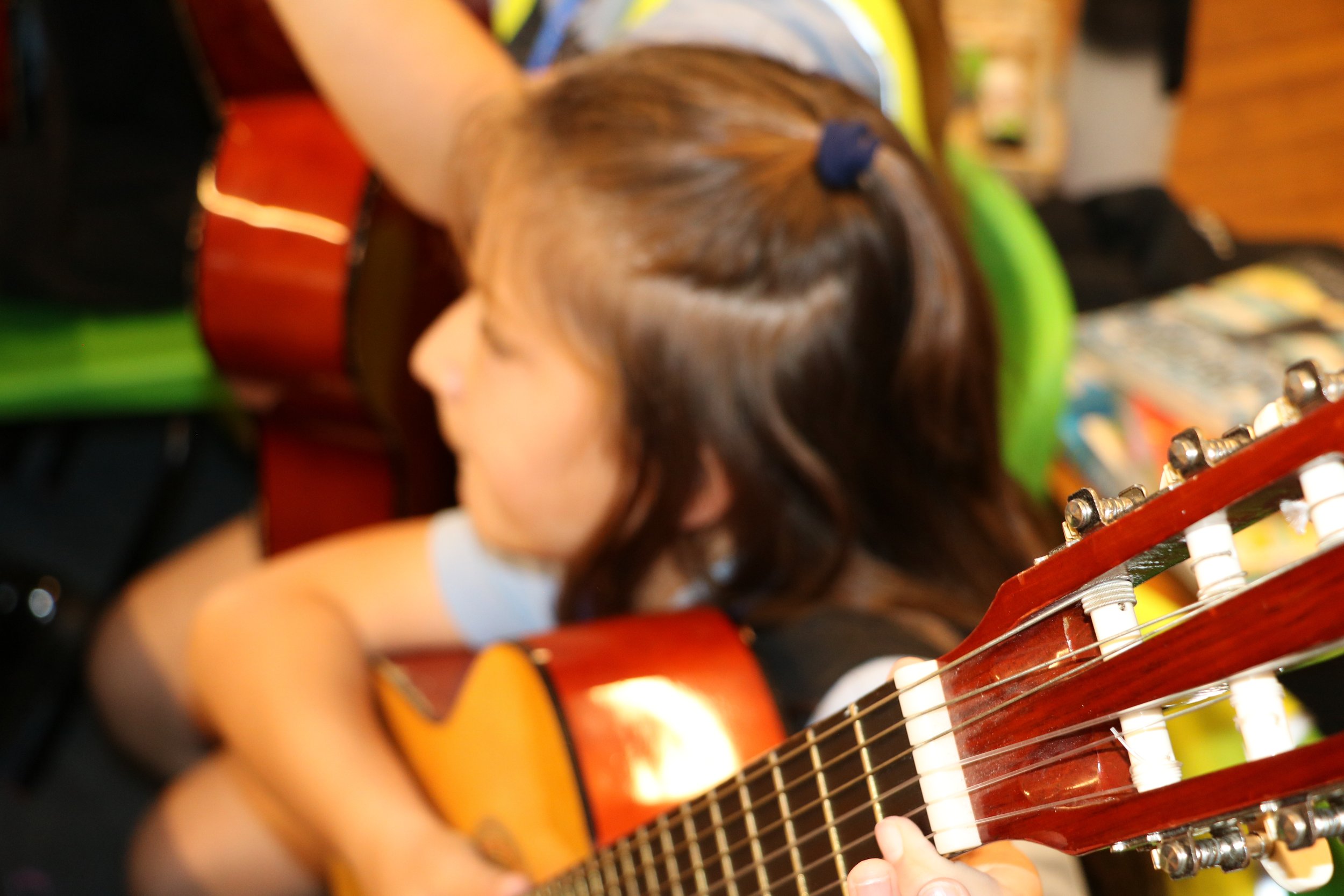 Child playing guitar