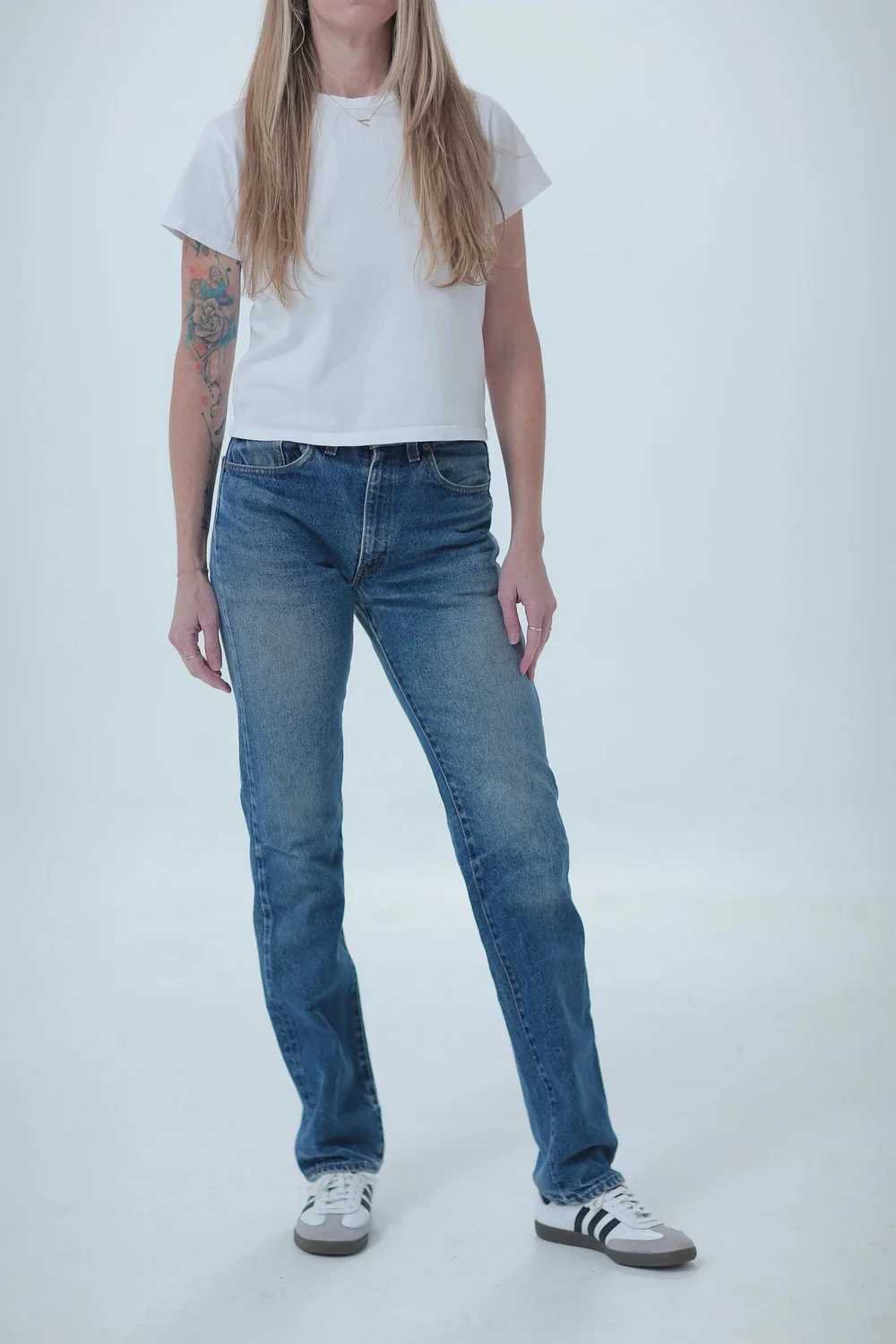 Levi's 505 darker medium wash, fitted, full length, front view with hip leaning