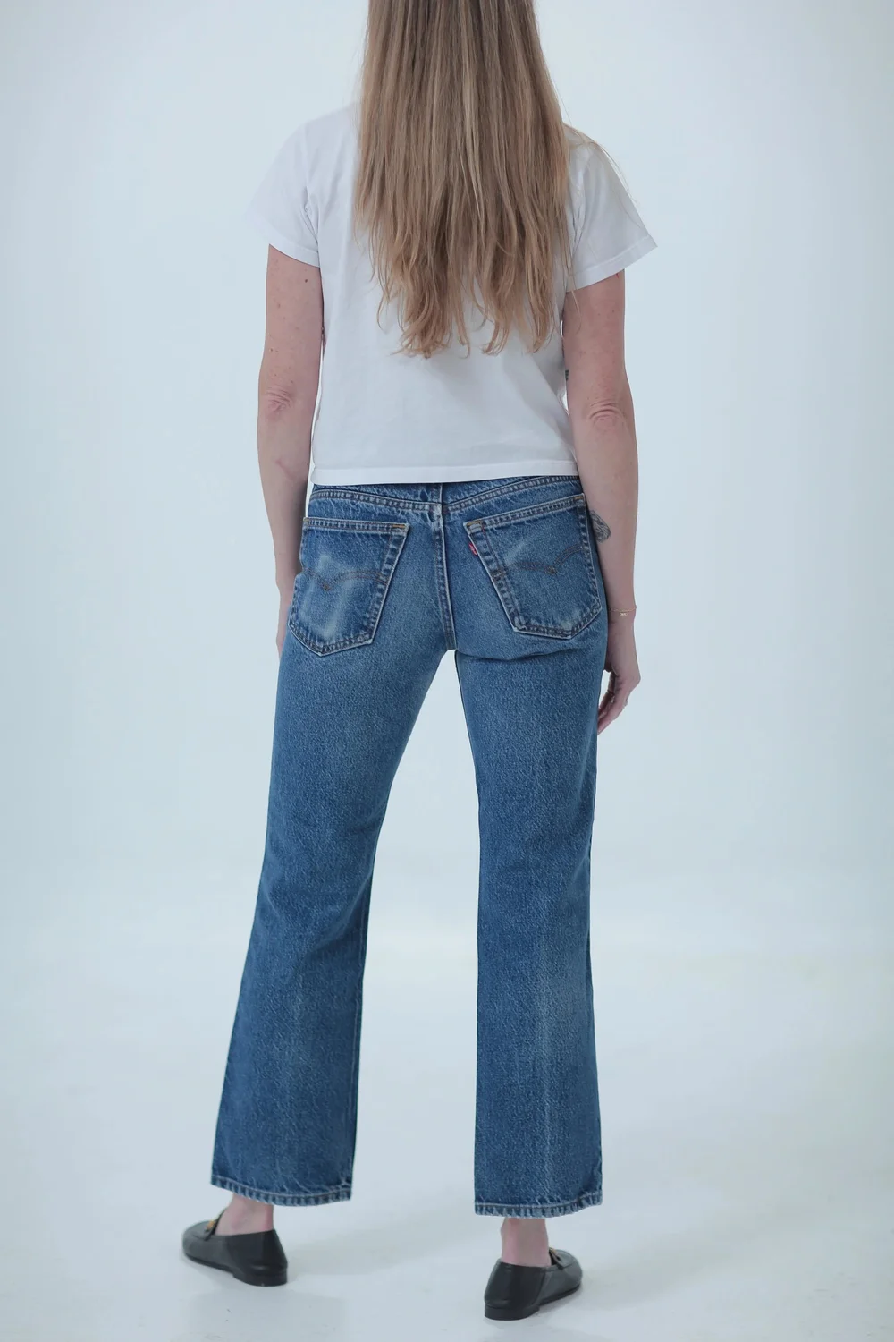 Levi's 517 darker wash, fitted in hips with a little room in waist, rear view
