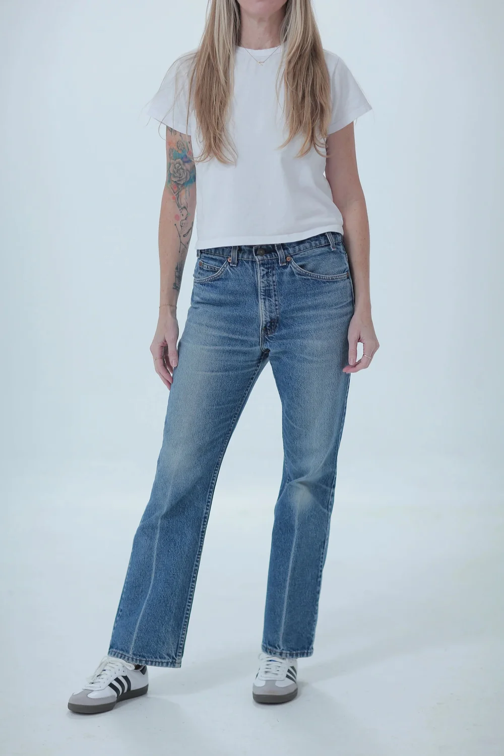 Levi's 517 lighter medium wash, boyfriend fit, low slung on hips, front view with hip leaning