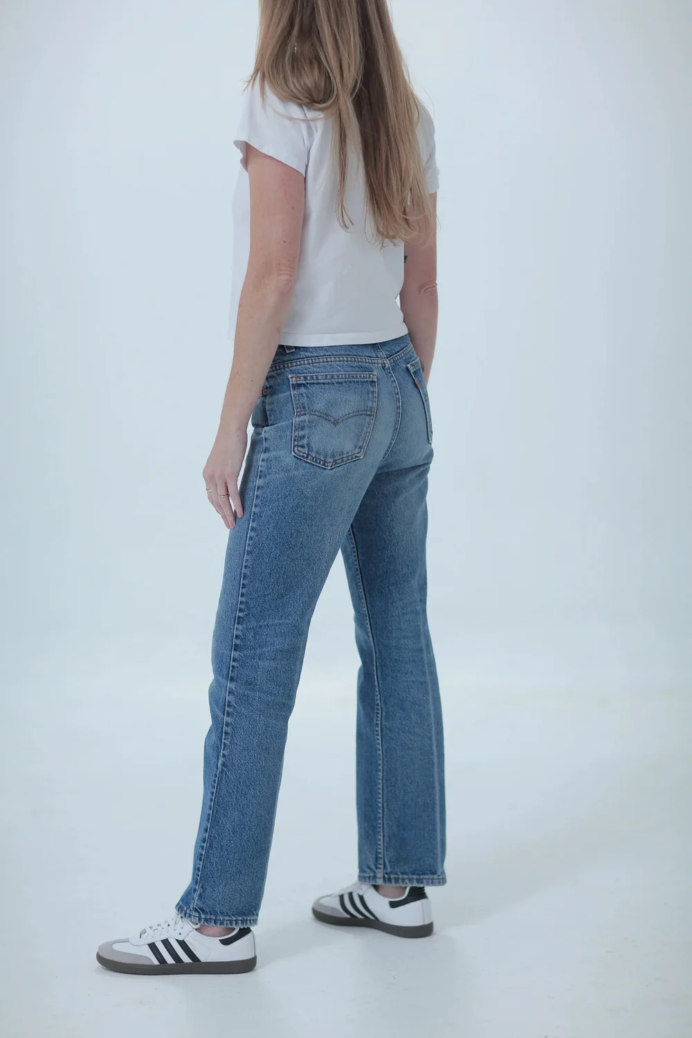 Levi's 517 lighter medium wash, boyfriend fit, low slung on hips, side view