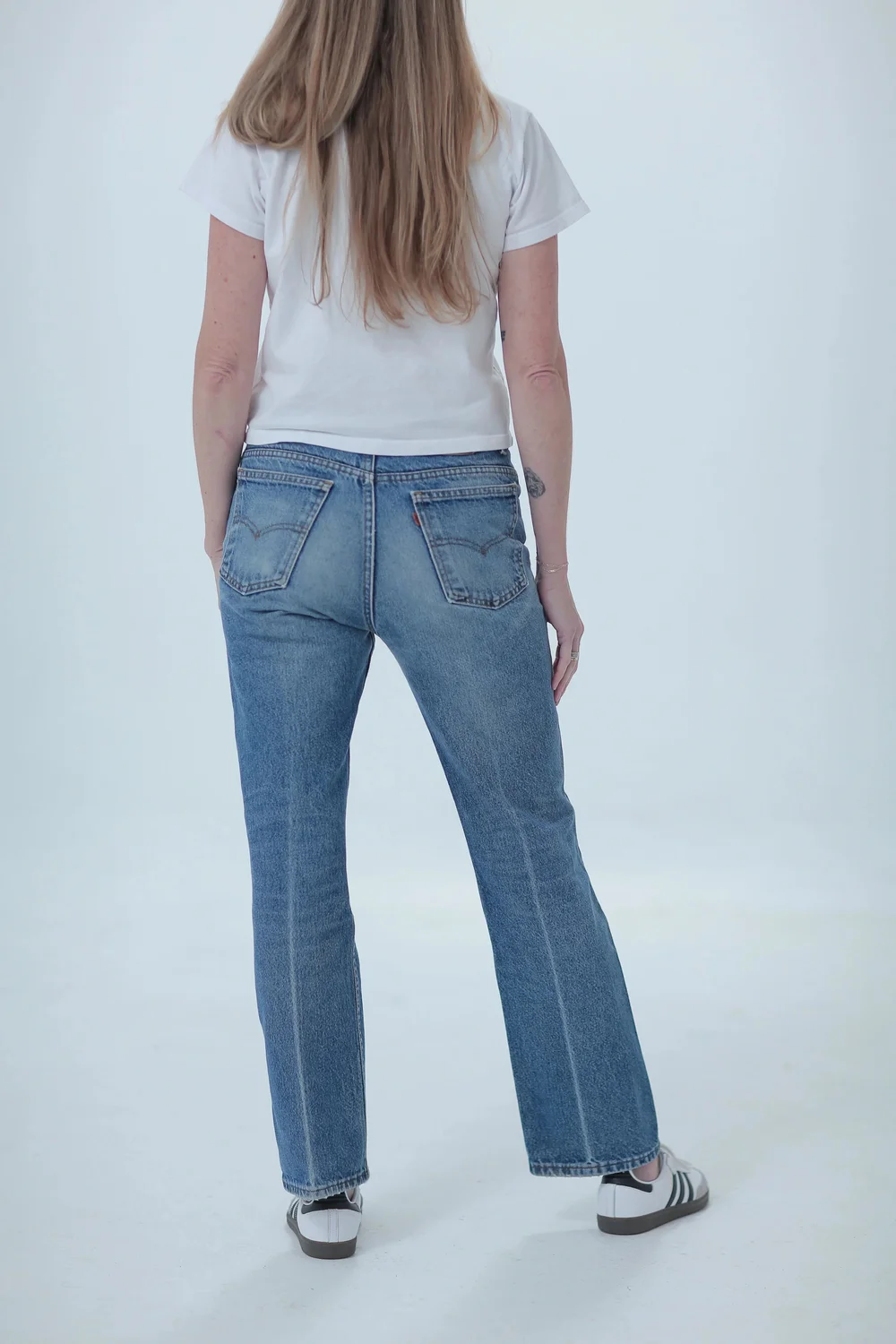 Levi's 517 lighter medium wash, boyfriend fit, low slung on hips, rear view