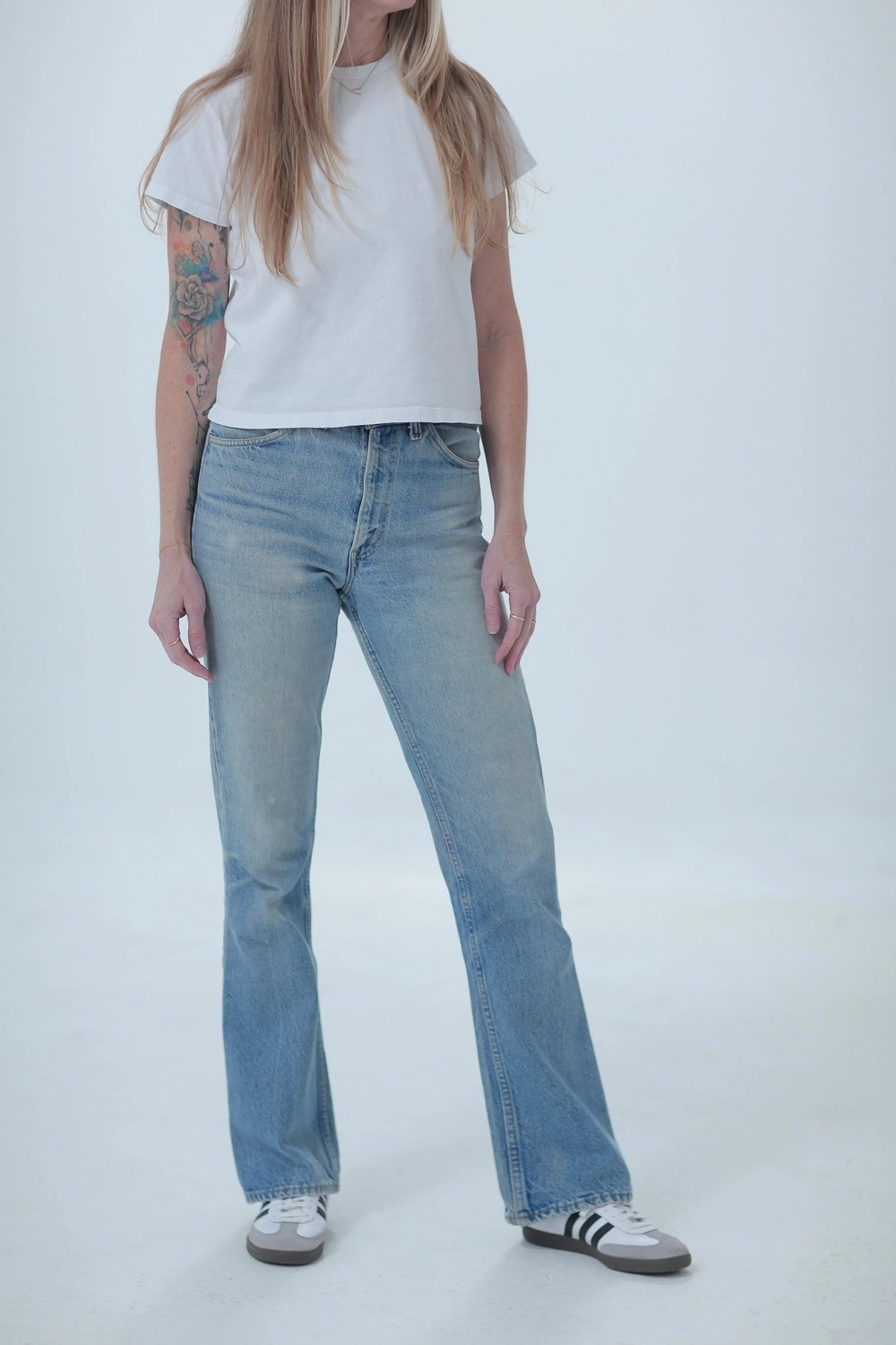 Levi's 646 lighter medium wash, fitted, front view with hip leaning