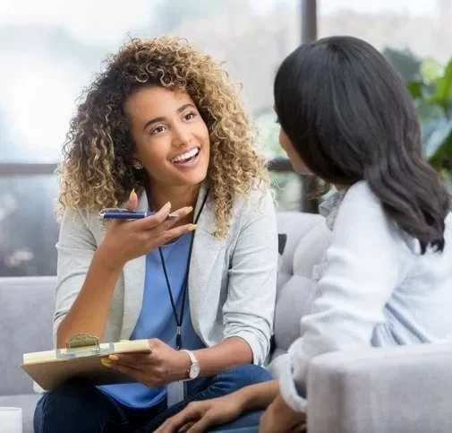 Female therapist explaining the Group Therapy Intake Process to a female client