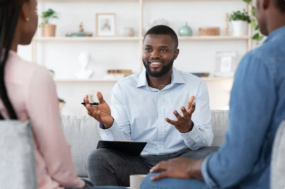 Smiling therapist working with couple