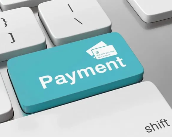 A keyboard with a large turquoise blue key labeled 'Payment' and a credit card icon above it.