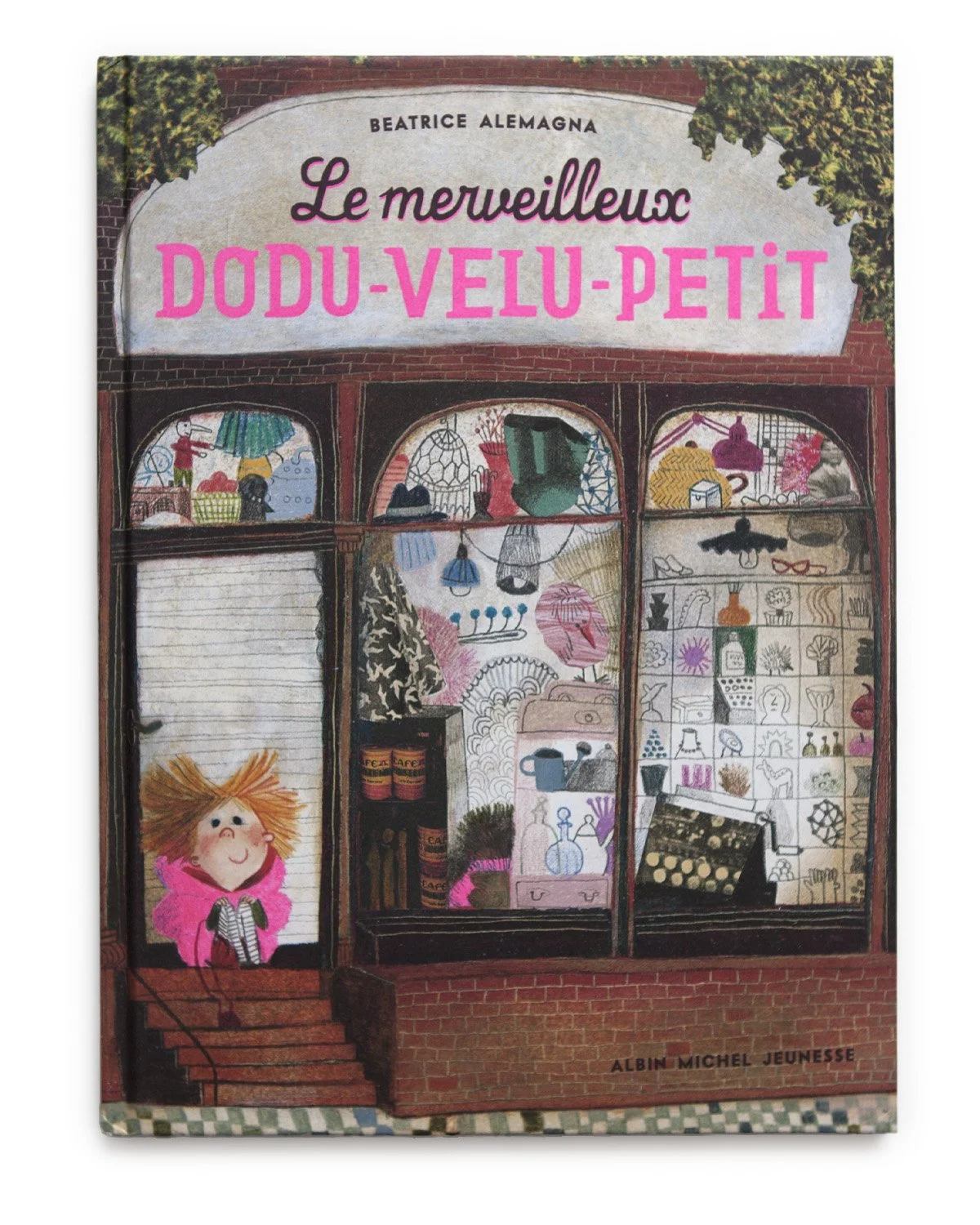 A children’s book cover titled 'Le merveilleux Dodu-Velu-Petit' by Beatrice Alemagna. The illustration depicts a storefront window with dolls, toys, and trinkets inside, and a child with orange hair and a pink coat standing on the stairs outside.