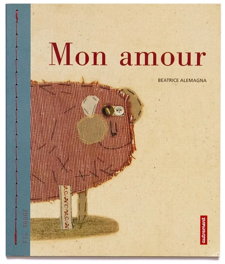 Cover of a book titled 'Mon amour' by Beatrice Alemagna featuring an illustration of a patchwork stuffed animal in the shape of a pig.