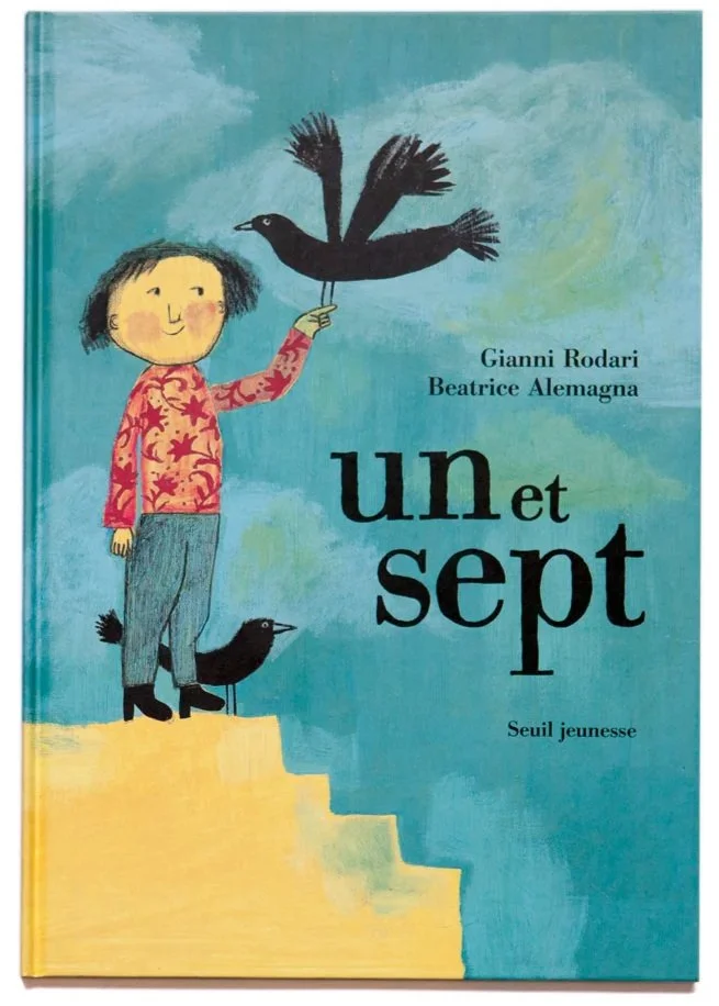 Cover of a children's book titled 'Un et Sept' by Gianni Rodari and Beatrice Alemagna. The illustration shows a girl with short dark hair, wearing a red patterned sweater and gray pants, standing on yellow stairs. She is holding a black bird that is perched on her finger, and there are two black birds, one perched on her head and another standing on the ground. The background is a blue sky with some clouds.