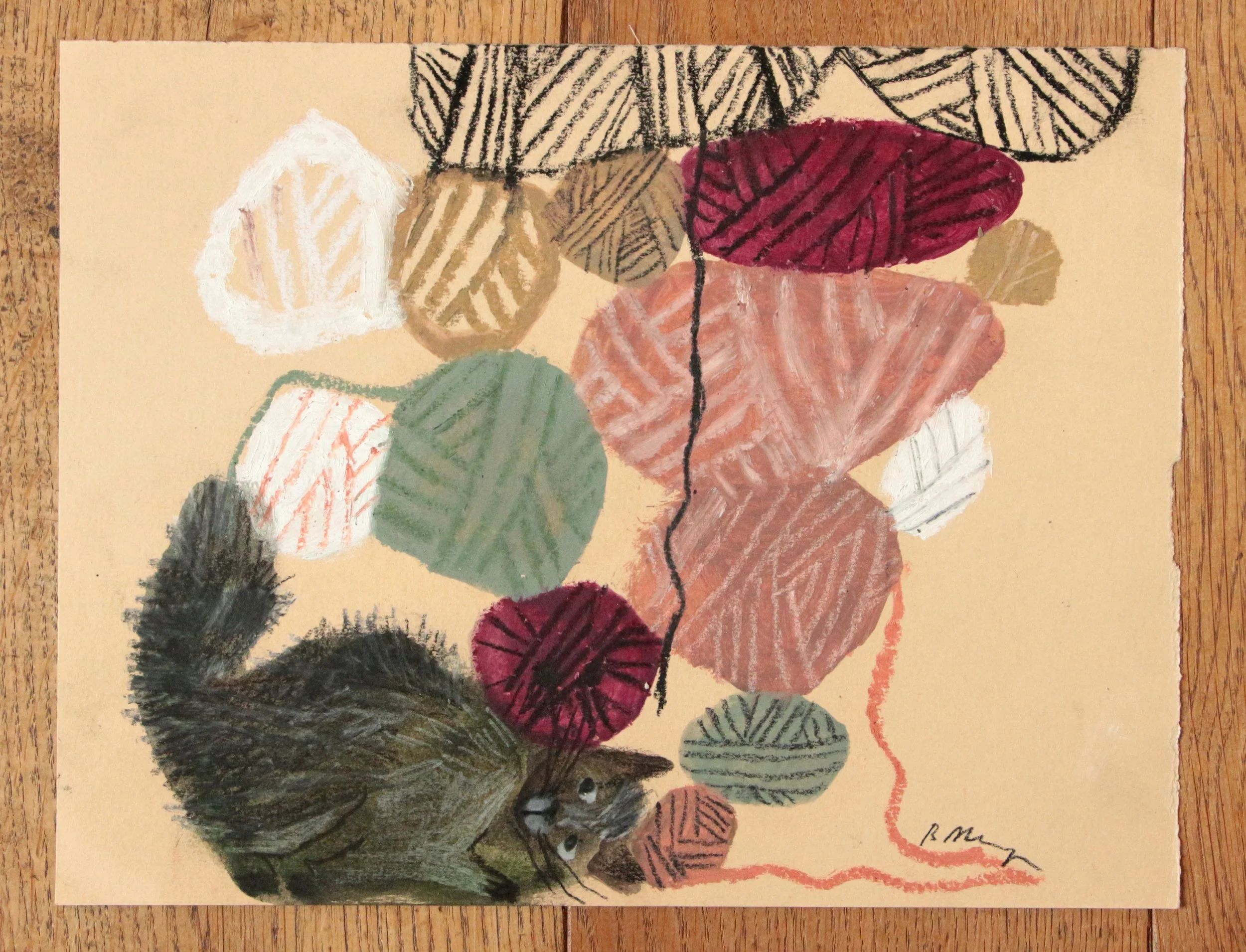 Balls of wool with a cat