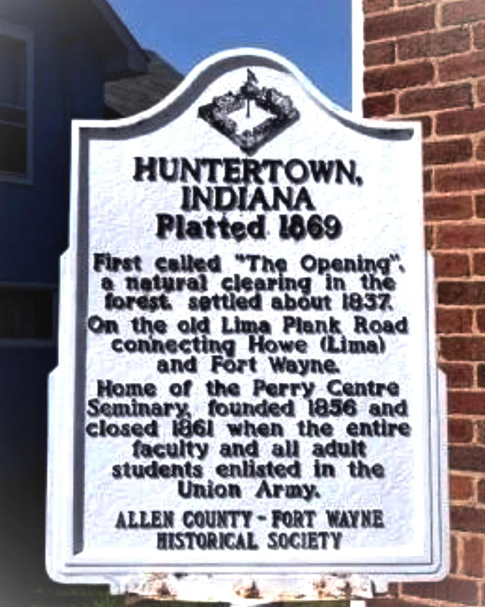 Historical marker for Huntertown, Indiana, platted in 1869, describing its history, location near Lima Plank Road and Fort Wayne, and its connection to the Perry Centre Seminary, founded in 1856, closed in 1961, and overseen by the Allen County - Fort Wayne Historical Society.