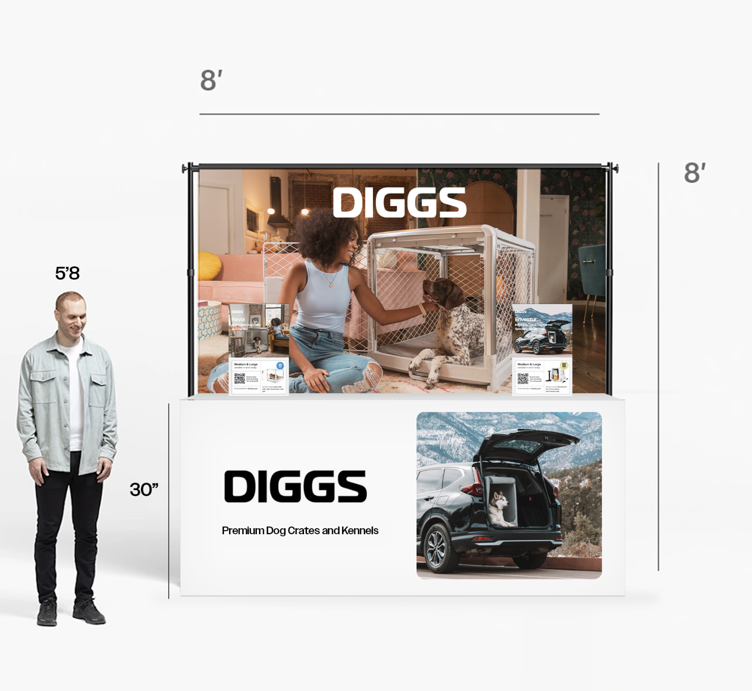 Trade show booth for Diggs featuring dog crates and kennels. The booth has a large display with a woman and a dog inside a crate, and a smaller image of a dog in a car trunk. A man stands to the left of the booth.