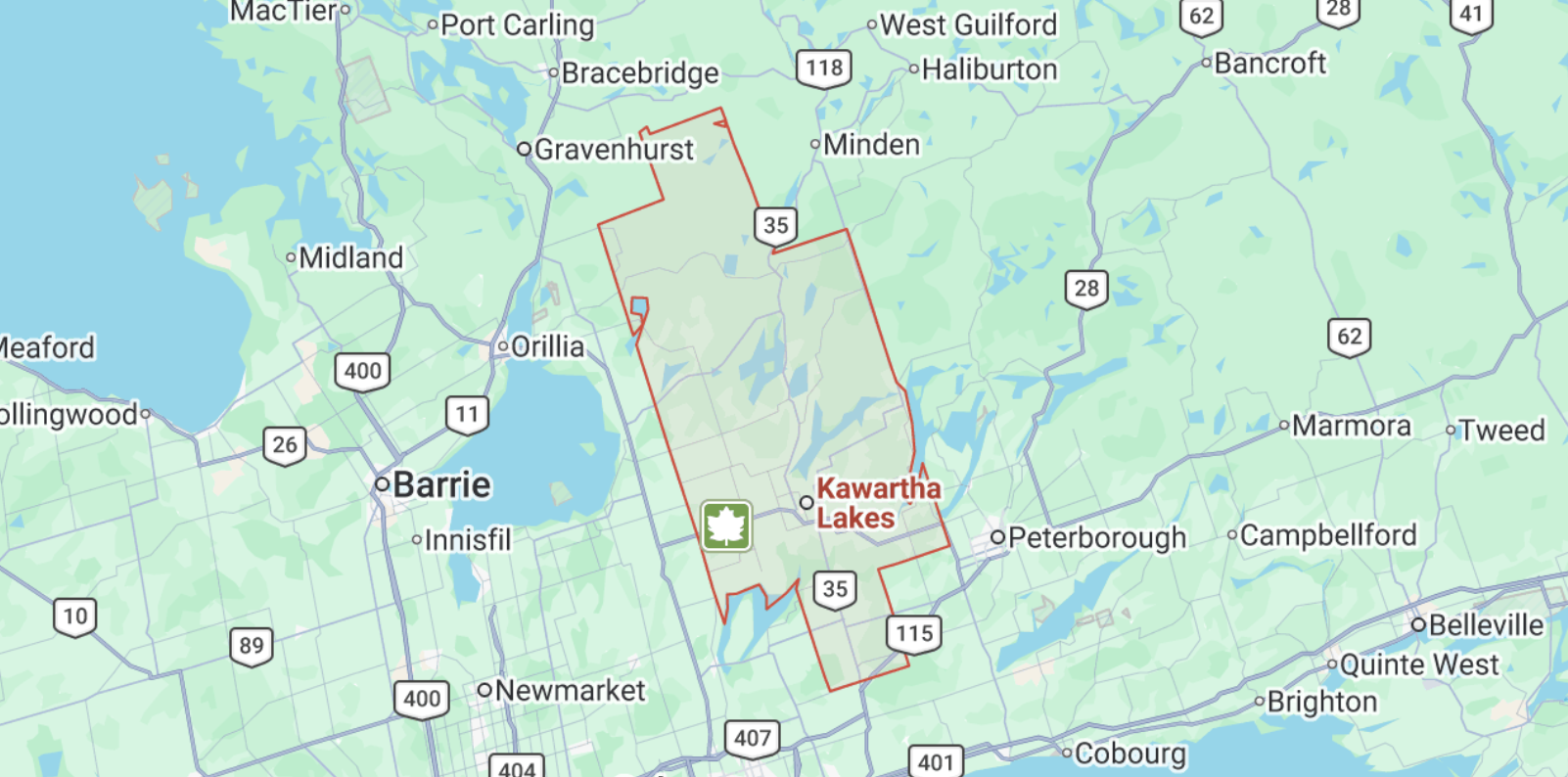 Map showing Kawartha Lakes in Ontario, Canada, with a red outline highlighting the area and a green tree icon indicating a park or natural area.