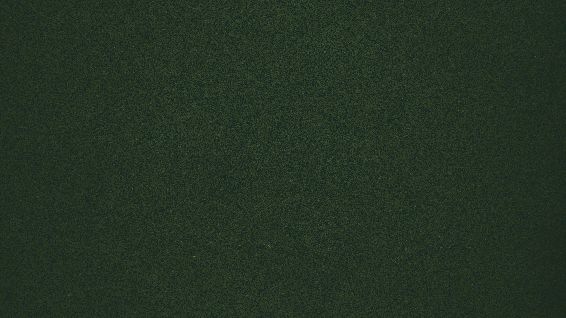 A solid dark green background with a textured, slightly grainy surface.