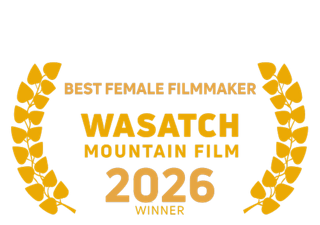 Award badge for the 2026 Wasatch Mountain Film Festival, recognizing the best female filmmaker, with a laurel wreath design.