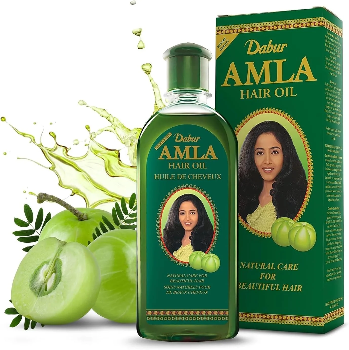 A bottle of Dabur Amla Hair Oil with its packaging box, along with a depiction of green amla fruits and green apples, and green leaves, with splashes of green liquid in the background.