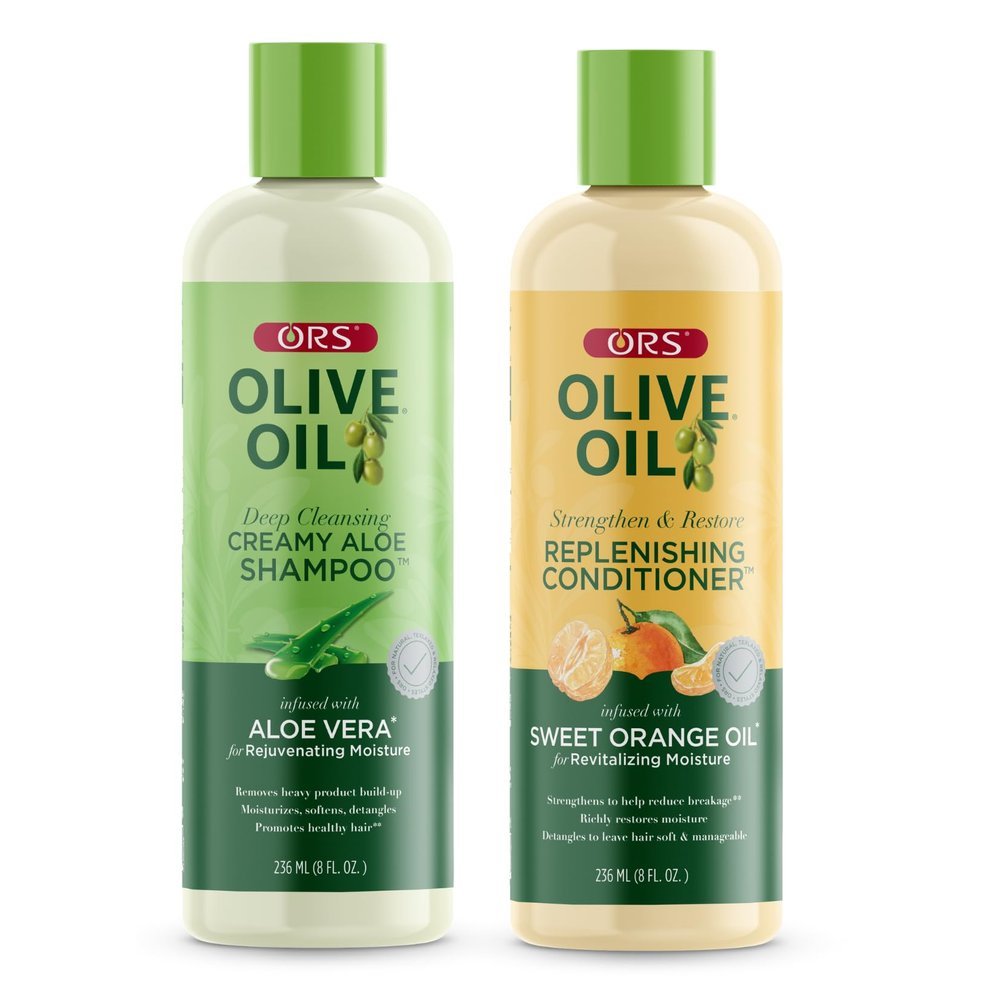 Two bottles of ORS Olive Oil hair products, one labeled Deep Cleansing Creamy Aloe Aloe Shampoo, and the other labeled Strengthen & Restore Replenishing Conditioner, with green caps and green labels featuring images of aloe vera and orange.