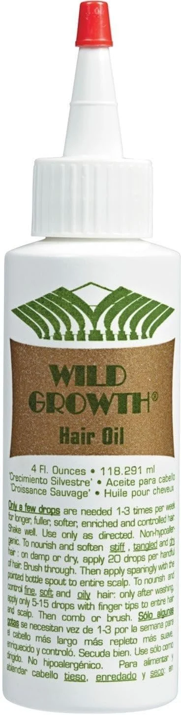 A bottle of Wild Growth Hair Oil with a white body, a red cap, and a green logo of stylized plant leaves.