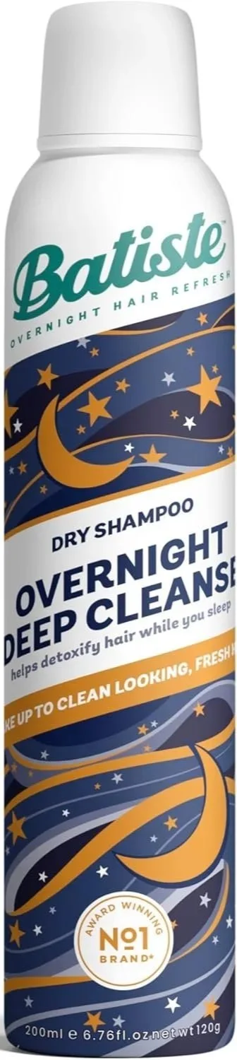 A can of Batistle Overnight Deep Night Leave dry shampoo with a white cap and a blue, gold, and white starry night design on the label.