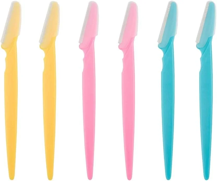 Six colorful dental floss picks in yellow, pink, and blue, arranged in a row.