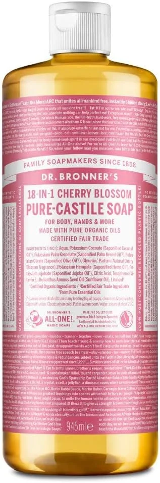 A bottle of Dr. Bronner's 18-in-1 Cherry Blossom Pure-Castile Soap with a white cap and pink and white label.