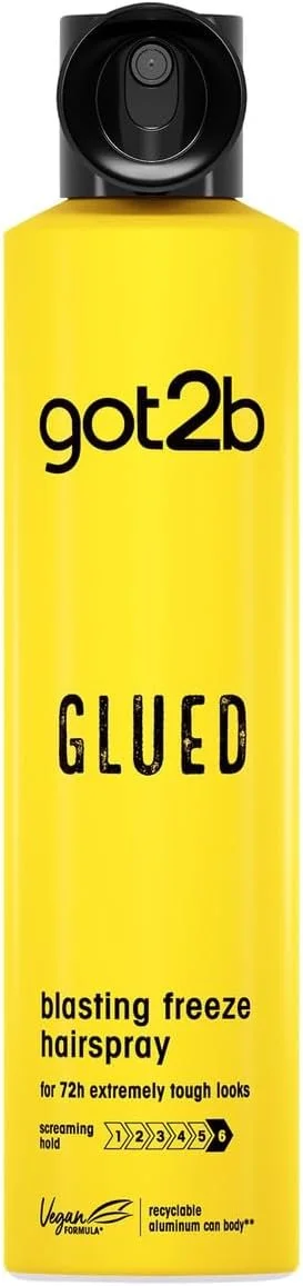 Yellow spray bottle labeled 'got2b GLUED blasting freeze hairspray' with a black spray nozzle.