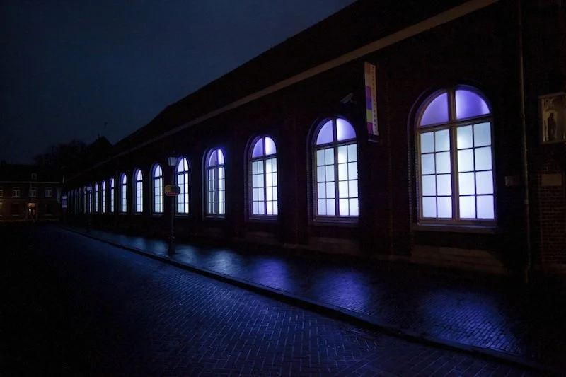 Love Motel for Insects: Museum Het Domein Variation. Museum Het Domein, Sittard, The Netherlands, 2014. Ultra-violet lights installed in museum windows, filters, invited insects. Photograph by Bert Janssen.