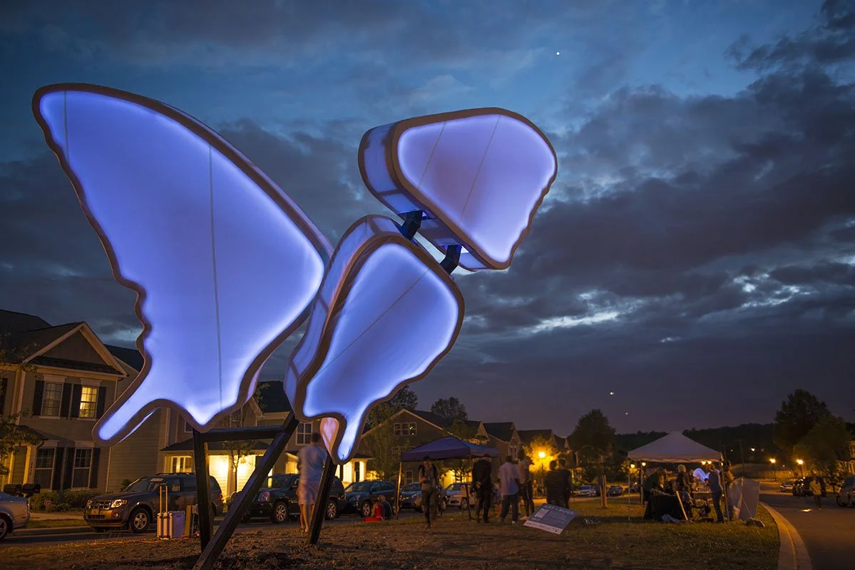 Love Motel for Insects: Eastern Tiger Swallowtail Variation. 2015. Brightwalk, Charlotte, NC. Outdoor light sculpture shaped after a Eastern Tiger Swallowtail butterfly (Papilio glaucus). Black Ultra-violet lights, steel, aluminum, fabric, native pla