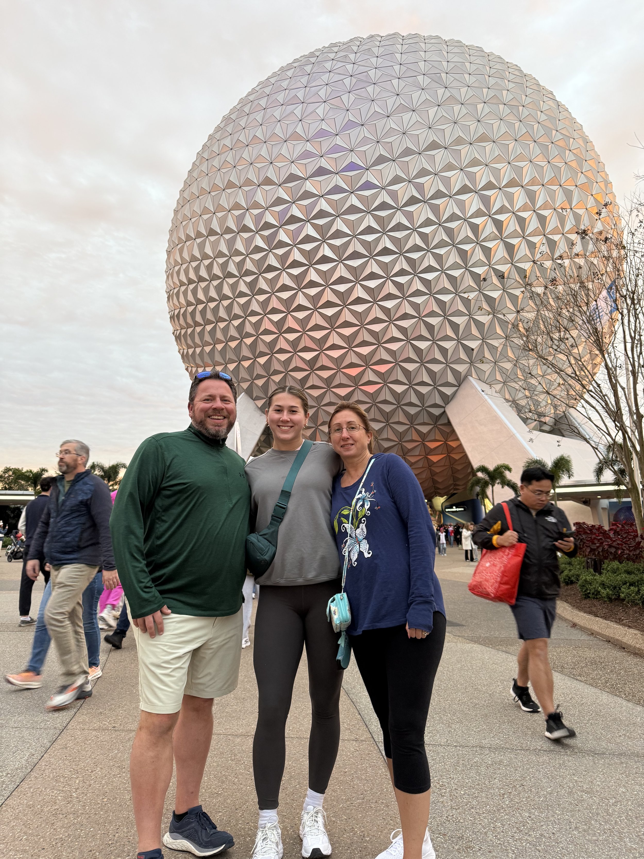 Stephanie and her parents at Disney.