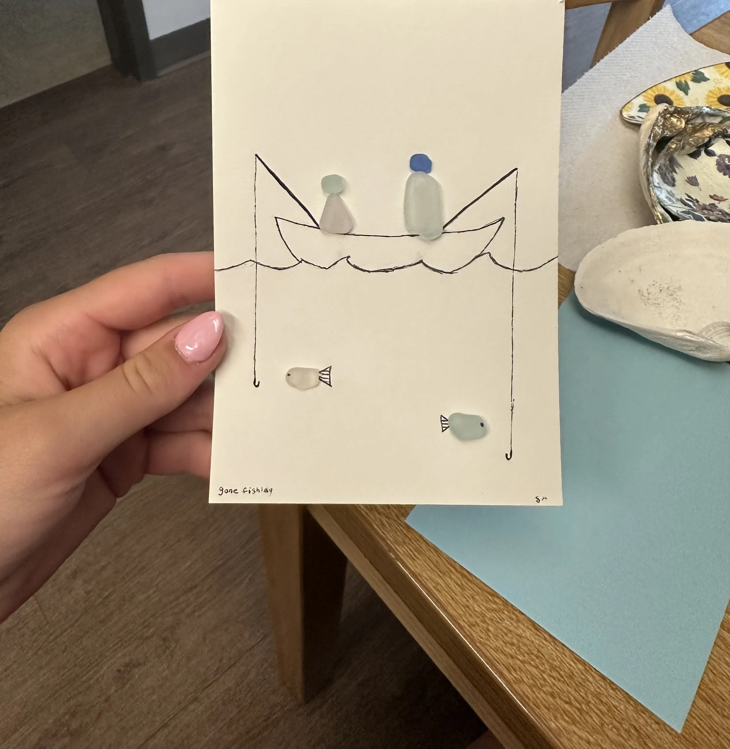 Two people fishing picture made from seaglass