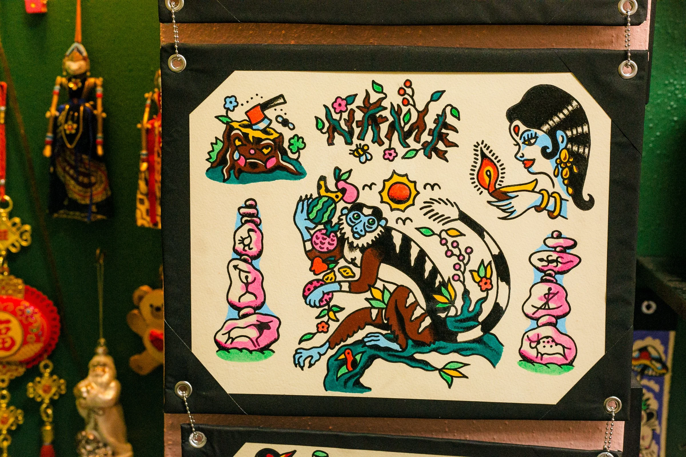 Colorful tattoo-style artwork of a lion with a crown, surrounded by flowers, a waterfall, and other decorative elements.