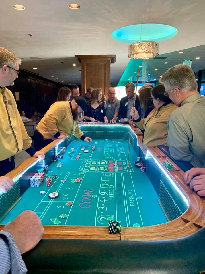 Interactive casino night blackjack setup at JPS Events at Regions Tower, showcasing the versatile blank-canvas venue layout, custom corporate event capabilities, and built-in full planning coordination.