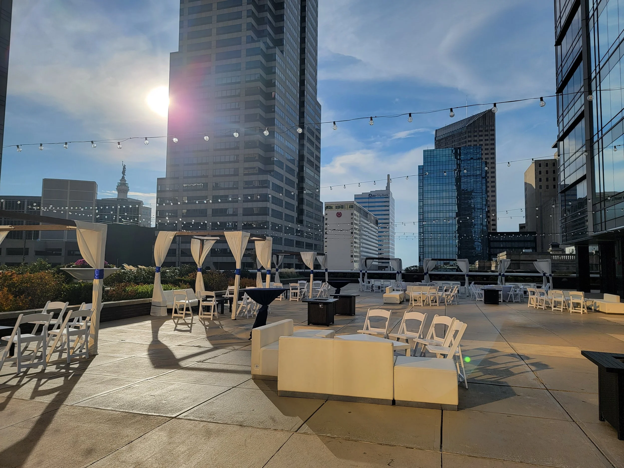 Outdoor corporate cocktail lounge setup on the 11,000 sq. ft. 5th-floor terrace at JPS Events at Regions Tower, featuring ambient string lighting, modern lounge furniture, and convenient access within walking distance of six major downtown hotels.