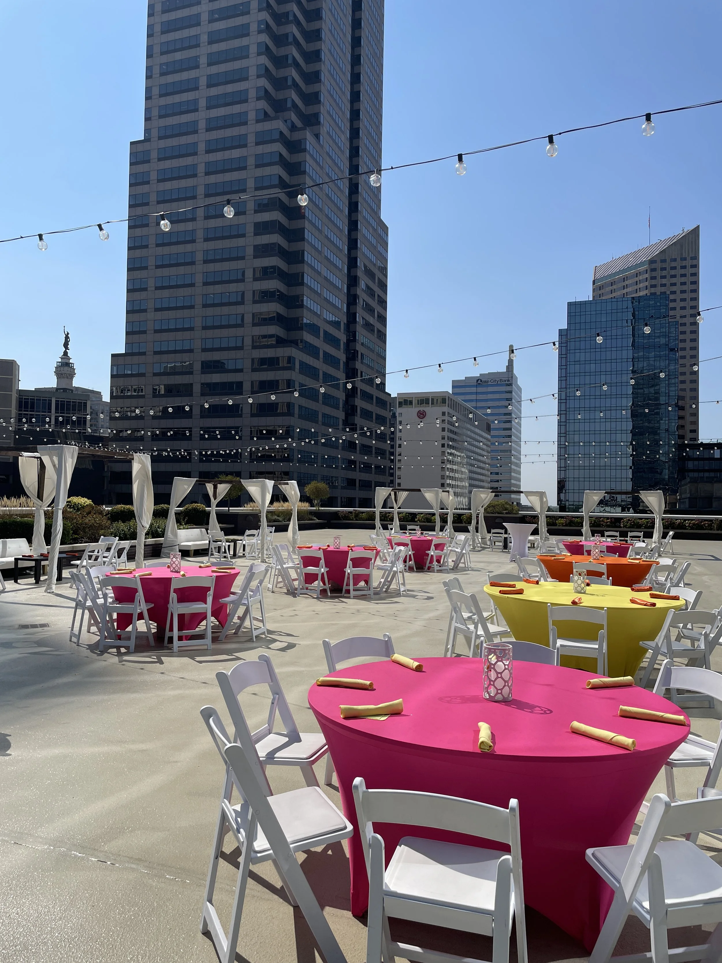 Vibrant corporate party on the 5th-floor penthouse terrace at JPS Events at Regions Tower, featuring custom colorful decor, complete setup and teardown, and close proximity to 6 downtown Indy hotels.