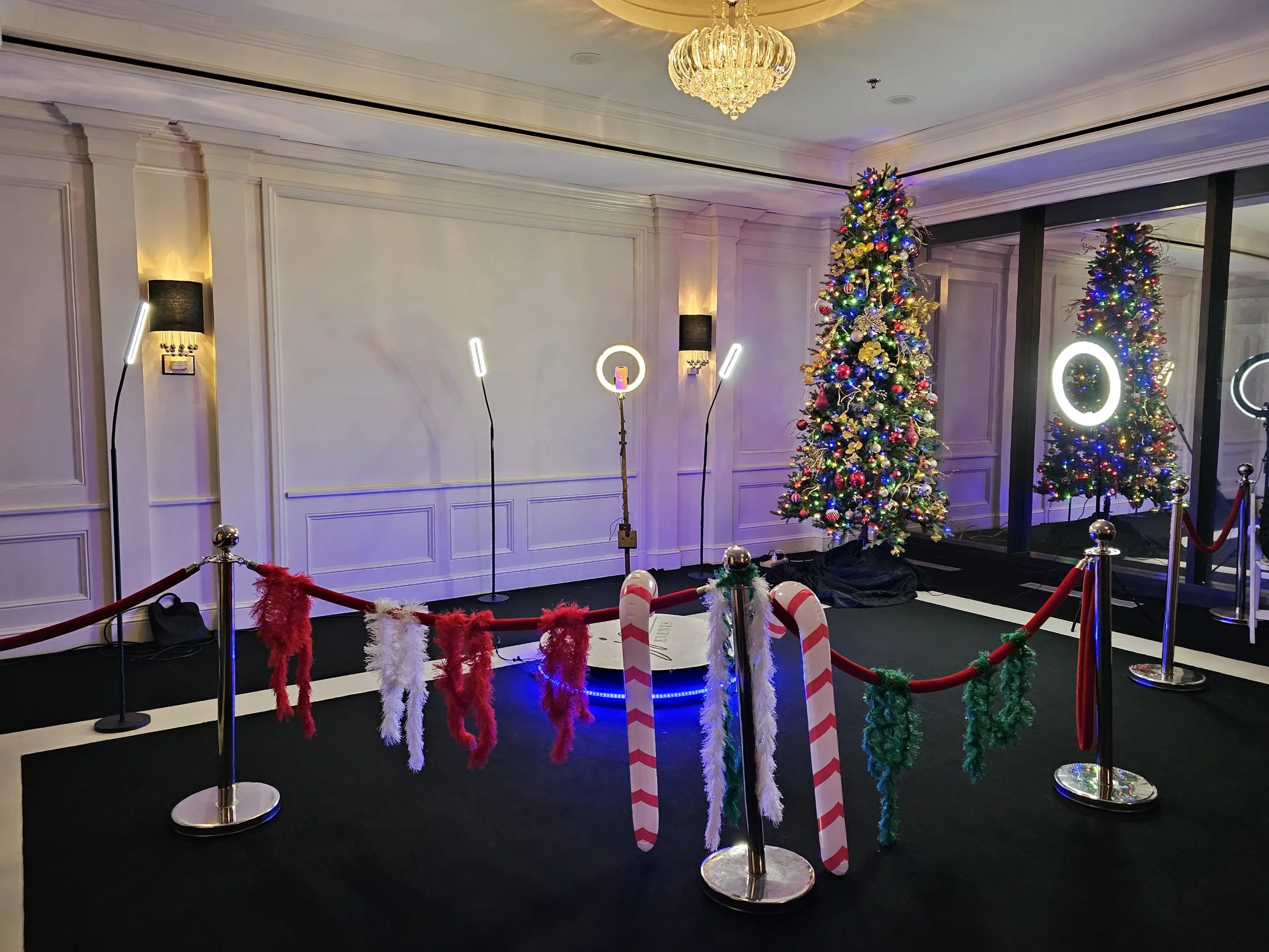 Festive corporate holiday 360 photo Booth experience at JPS Events at Regions Tower, featuring custom seasonal decor by our in-house team, ring lights, and complete event coordination in downtown Indy.