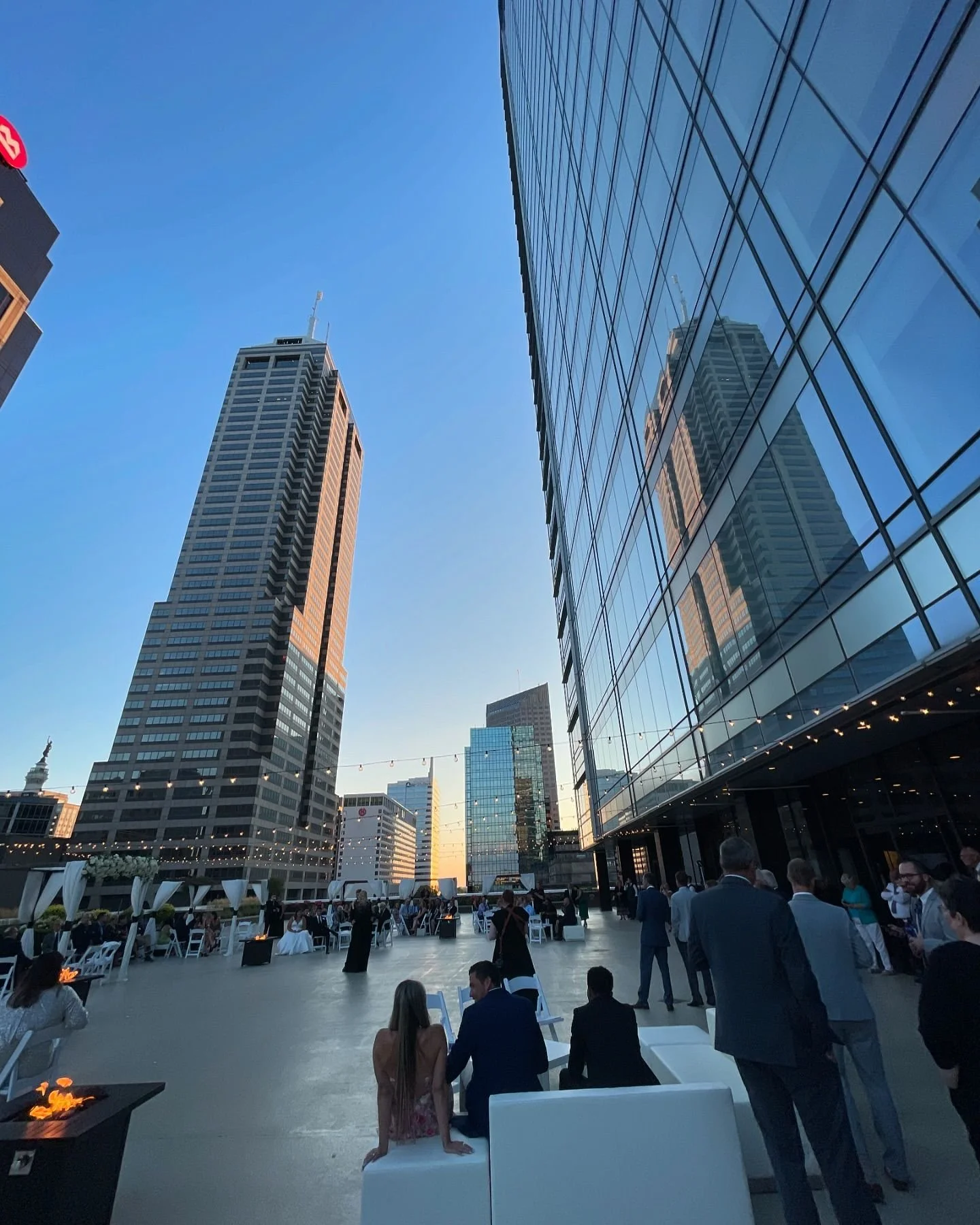 Sunset cocktail hour on the 11,000 sq ft rooftop terrace at JPS Events at Regions Tower in downtown Indy. Hosts 100-300 guests with 360 skyline views within walking distance of 6 major downtown hotels.