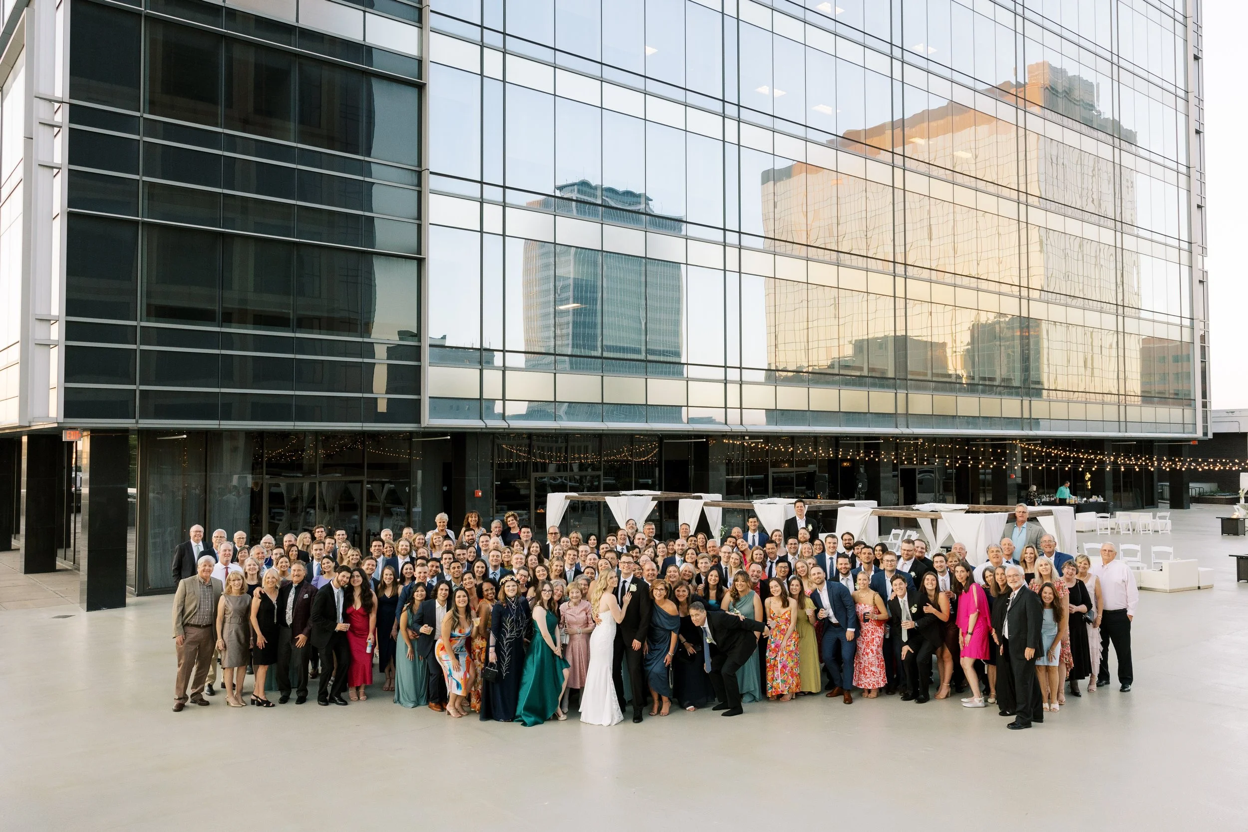 Large wedding group photo on the outdoor terrace at JPS Events at Regions Tower in downtown Indy. Conveniently located near Monument Circle within walking distance of 6 major downtown hotels for guests.