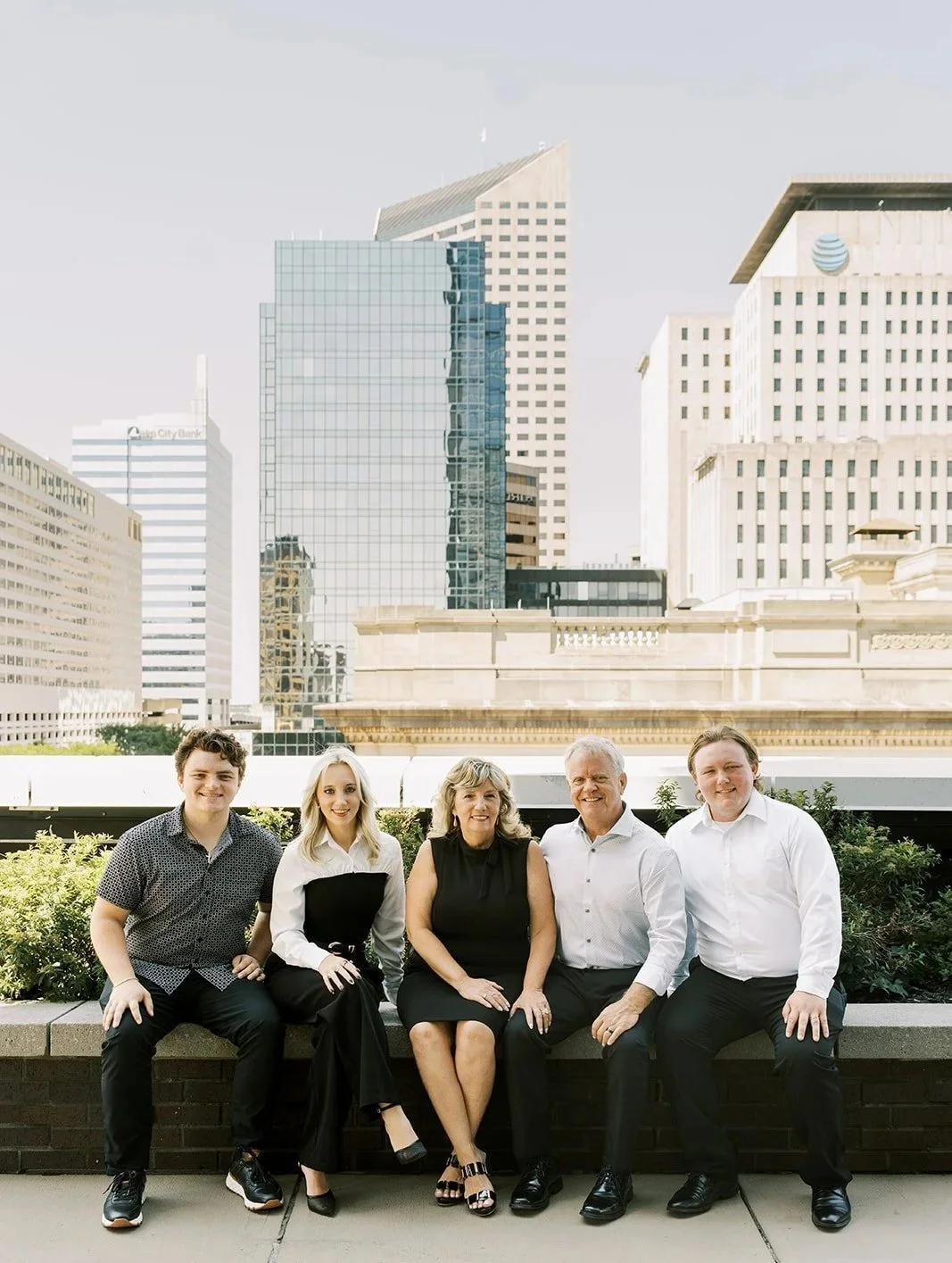 The Stowers family, owners of JPS Events at Regions Tower, on the 11,000 sq ft 5th-floor penthouse terrace. Downtown Indianapolis's premier family-owned, all-inclusive luxury wedding venue offering in-house catering, floral, and coordination.