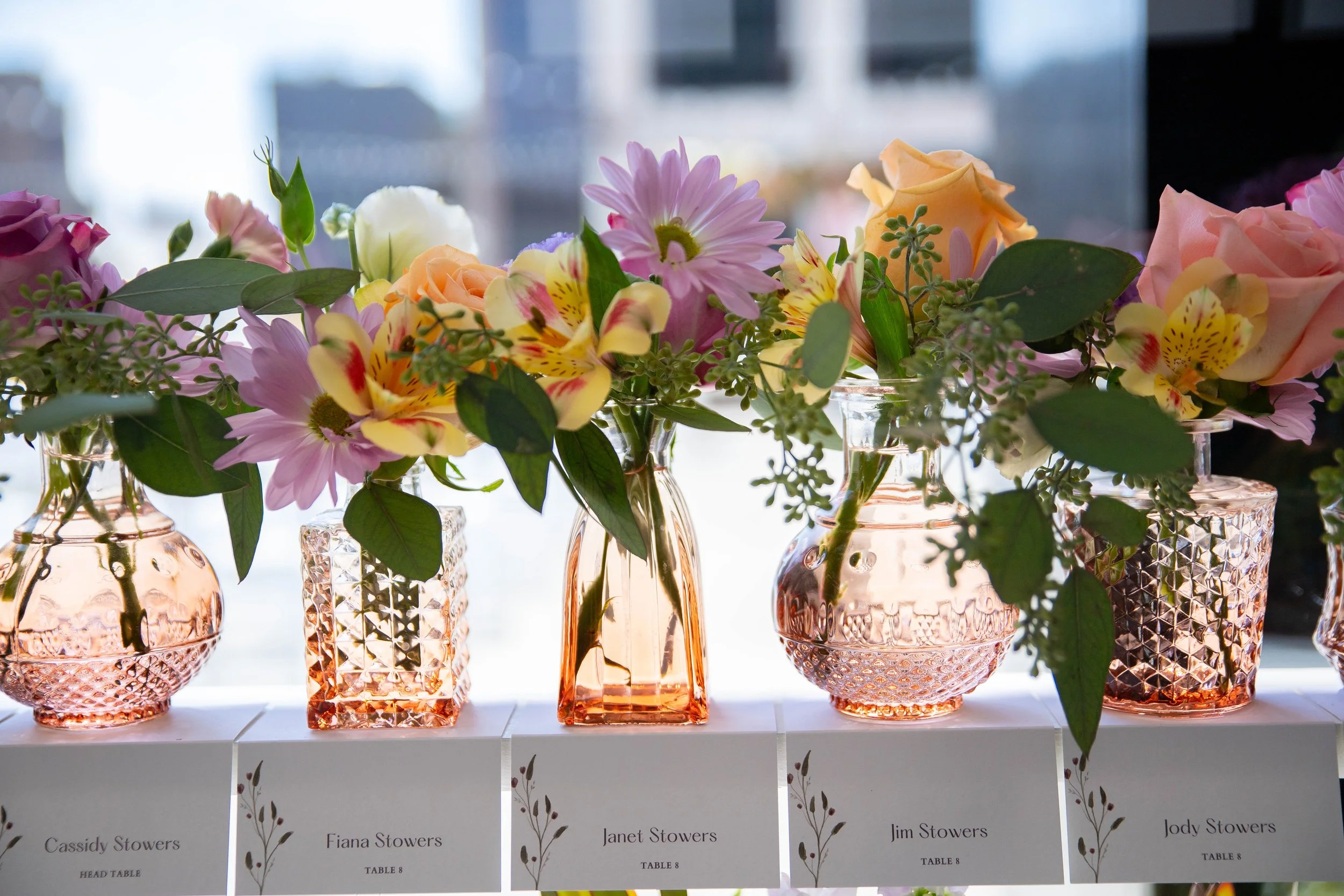 Custom pastel floral place settings designed by the in-house floral team at JPS Events at Regions Tower. Offers over-the-top tablescape styling at wholesale pricing with built-in day-of coordination in downtown Indy.