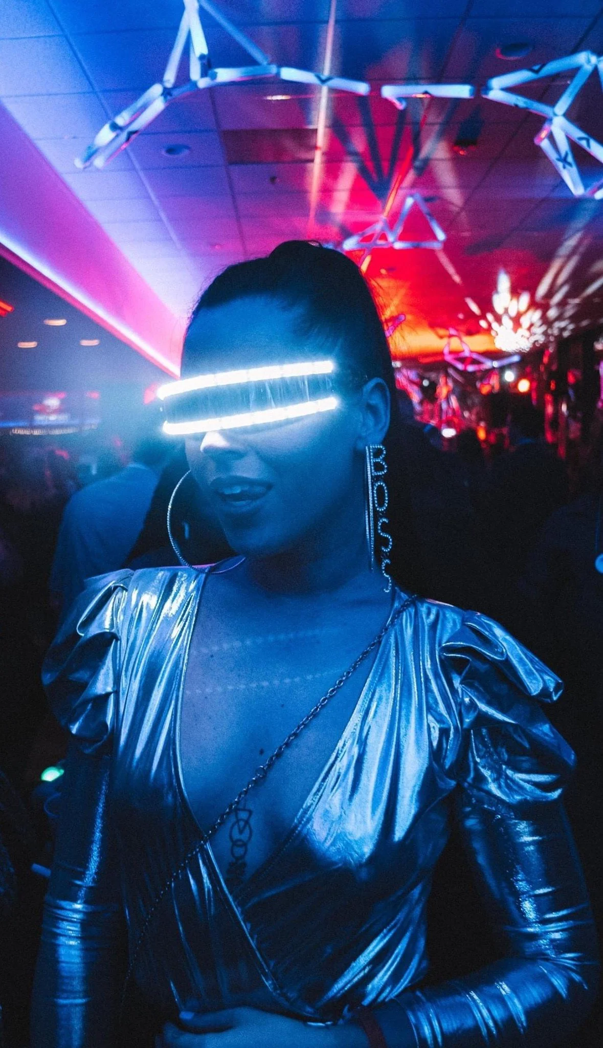 Guest celebrating at the HOT NYE event at JPS Events at Regions Tower in downtown Indianapolis, showcasing dynamic neon lighting, high-energy nightlife production, and flexible modern blank-canvas venue styling.