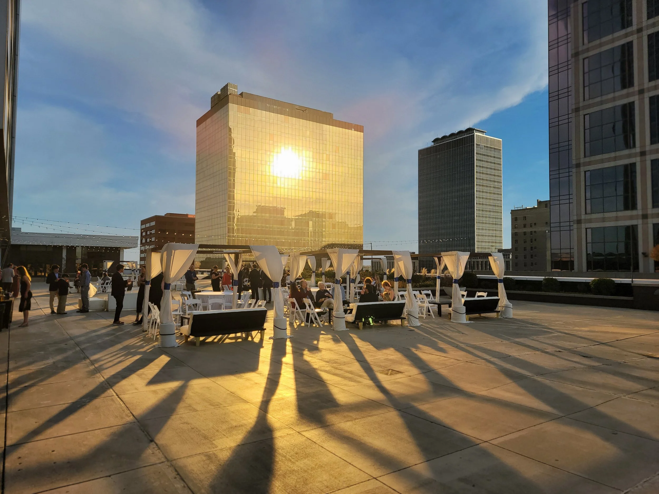 Corporate cocktail hour on the 11,000 sq ft 5th-floor penthouse terrace at JPS Events at Regions Tower, featuring all-inclusive setup and teardown with zero late-out fees in downtown Indianapolis.