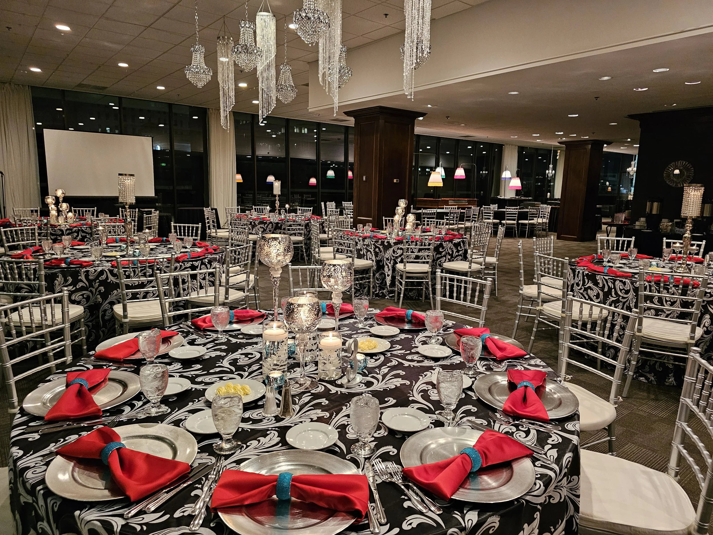 Corporate banquet setup at JPS Events at Regions Tower, featuring in-house custom decor, chandelier lighting, and all-inclusive full-service event coordination in downtown Indianapolis.