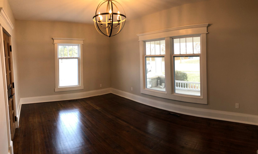 Oranssi technician working on a roof project