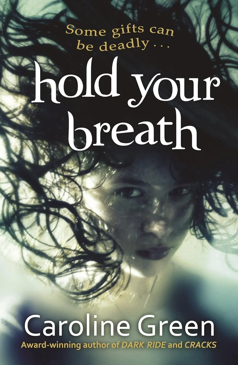 Book cover for 'Hold Your Breath' by Caroline Green featuring a woman's face underwater with dark, curly hair floating around her.