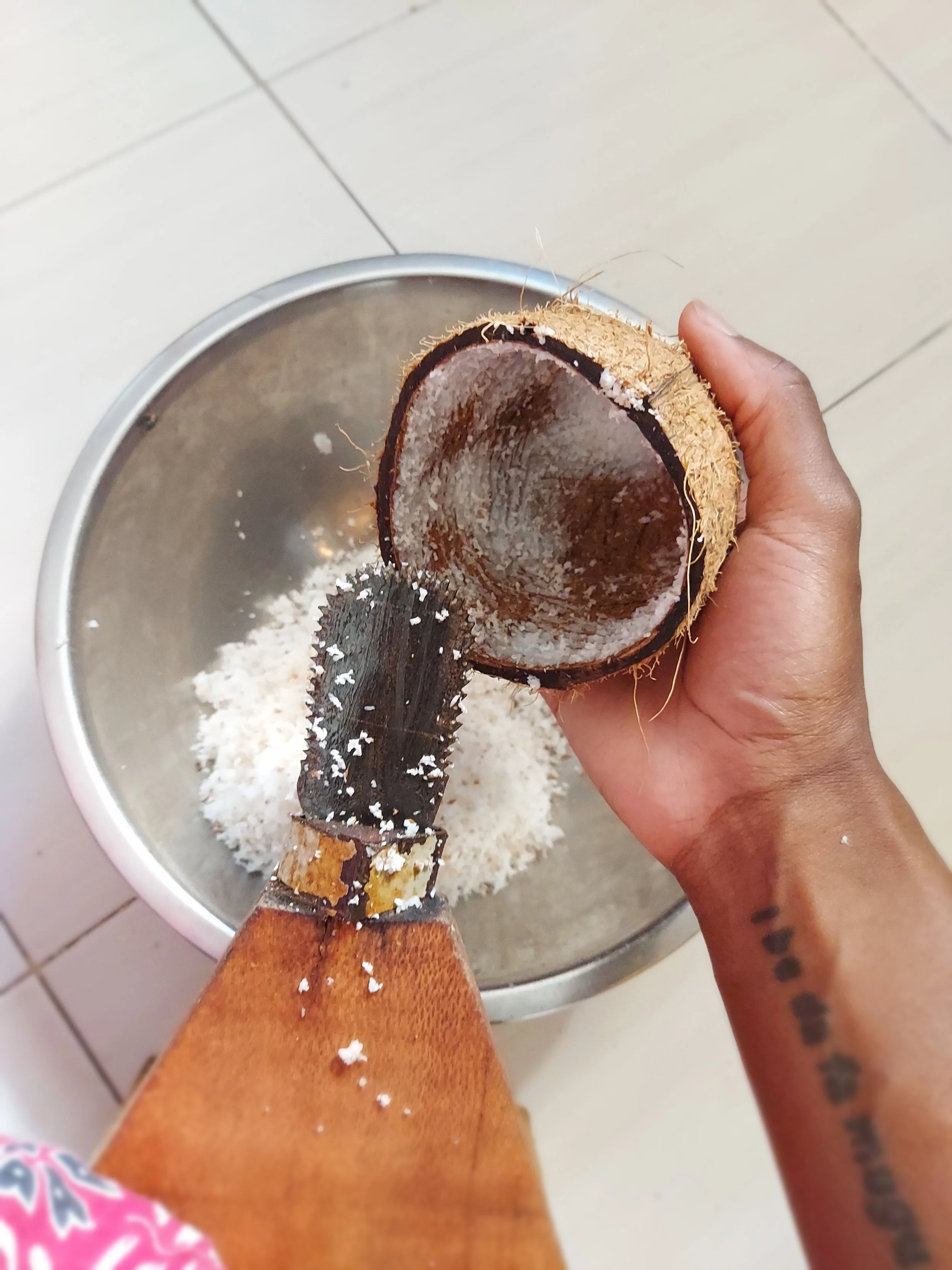 Grating the coconut on the Mbuzi