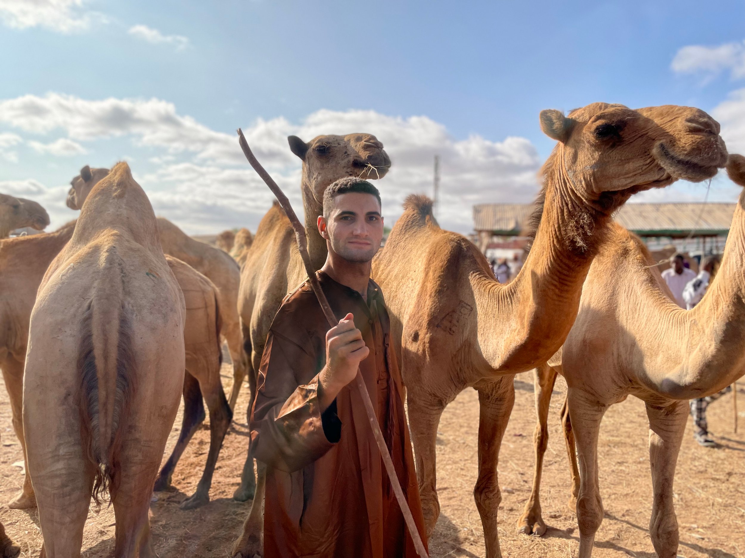 Cameron  Mofid with Camels during his world trip