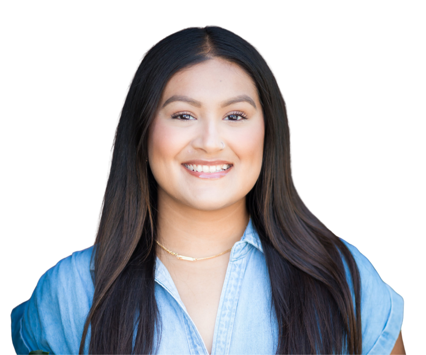A young woman with long dark hair, wearing a light blue shirt and a gold necklace, smiling at the camera.