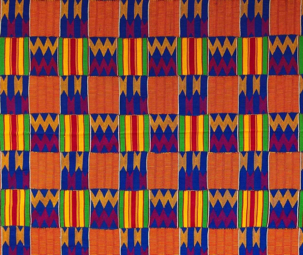 Pattern of colorful Kente cloth with alternating designs, including geometric shapes in red, yellow, green, blue, and gold colors.