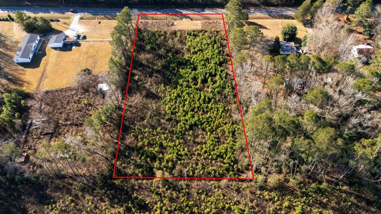 Drone photography showing land boundaries, road access, and surrounding properties in Fayetteville NC